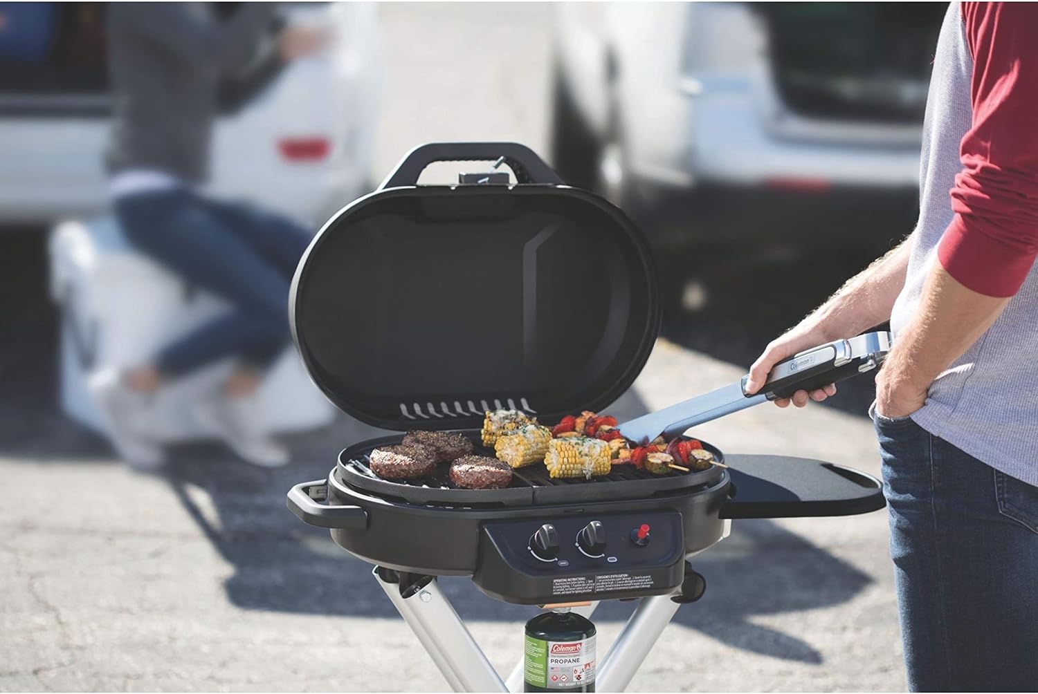 Coleman RoadTrip 225 Portable Stand-Up Propane Grill, Gas Grill with Push-Button Starter, Folding Legs & Wheels, Side Table, & 11,000 BTUs of Power for Camping, Tailgating, Grilling & More